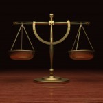 Gold Scales of Justice on wood table