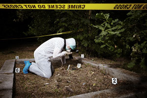 A crime scene, person taking photos for investigation
