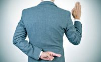 young man swearing an oath, crossing his fingers in his back