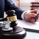 #9867034 Mallet And Stethoscope Over Sound Block In Court