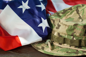 US flag with camouflage cap combat hat